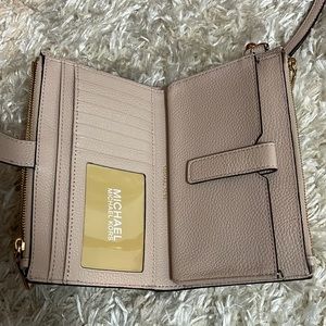 Very light pink MK wristlet